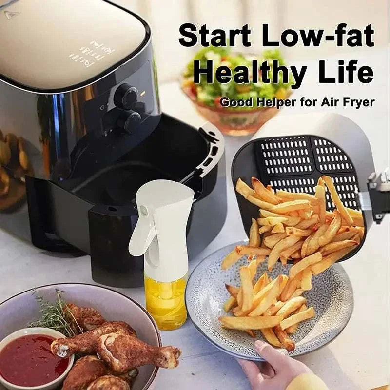 Oil spray bottle near air fryer with fries, promoting low-fat healthy cooking.