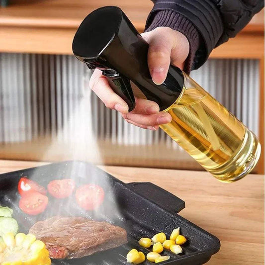 Oil spray bottle used for cooking and baking, dispensing even mist on food.