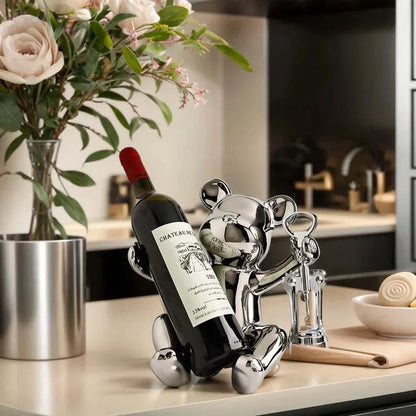 Ceramic bear wine rack holding wine bottle in modern kitchen setting.