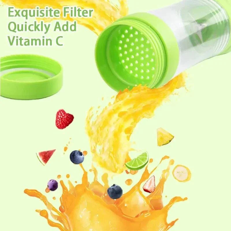 Portable fruit juice blender with green cap and filter, surrounded by fruit and juice splashes.
