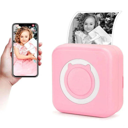 Portable mini thermal printer in pink with wireless connectivity, displaying printed black-and-white photo.