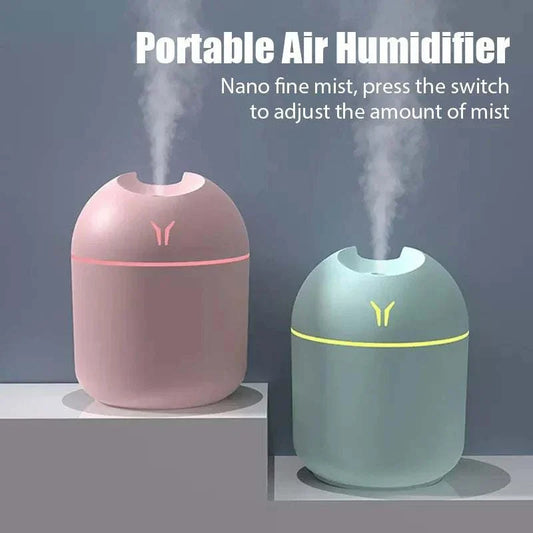 Portable 250ML mini aroma diffuser with LED light, USB-powered essential oil humidifier in pink and blue.