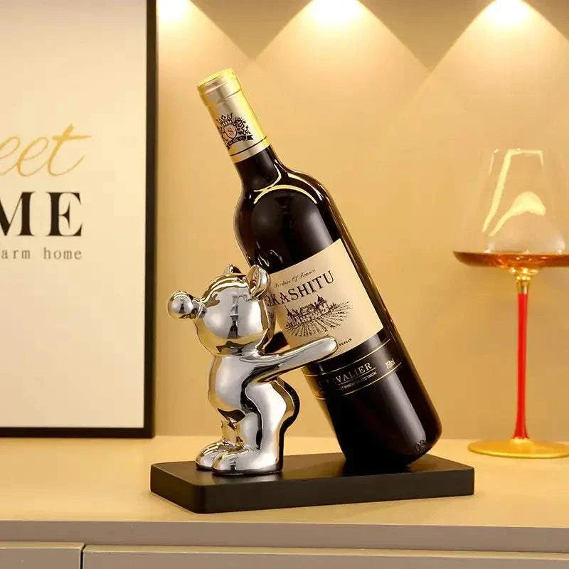 Ceramic bear wine rack holding wine bottle, home and kitchen decor.