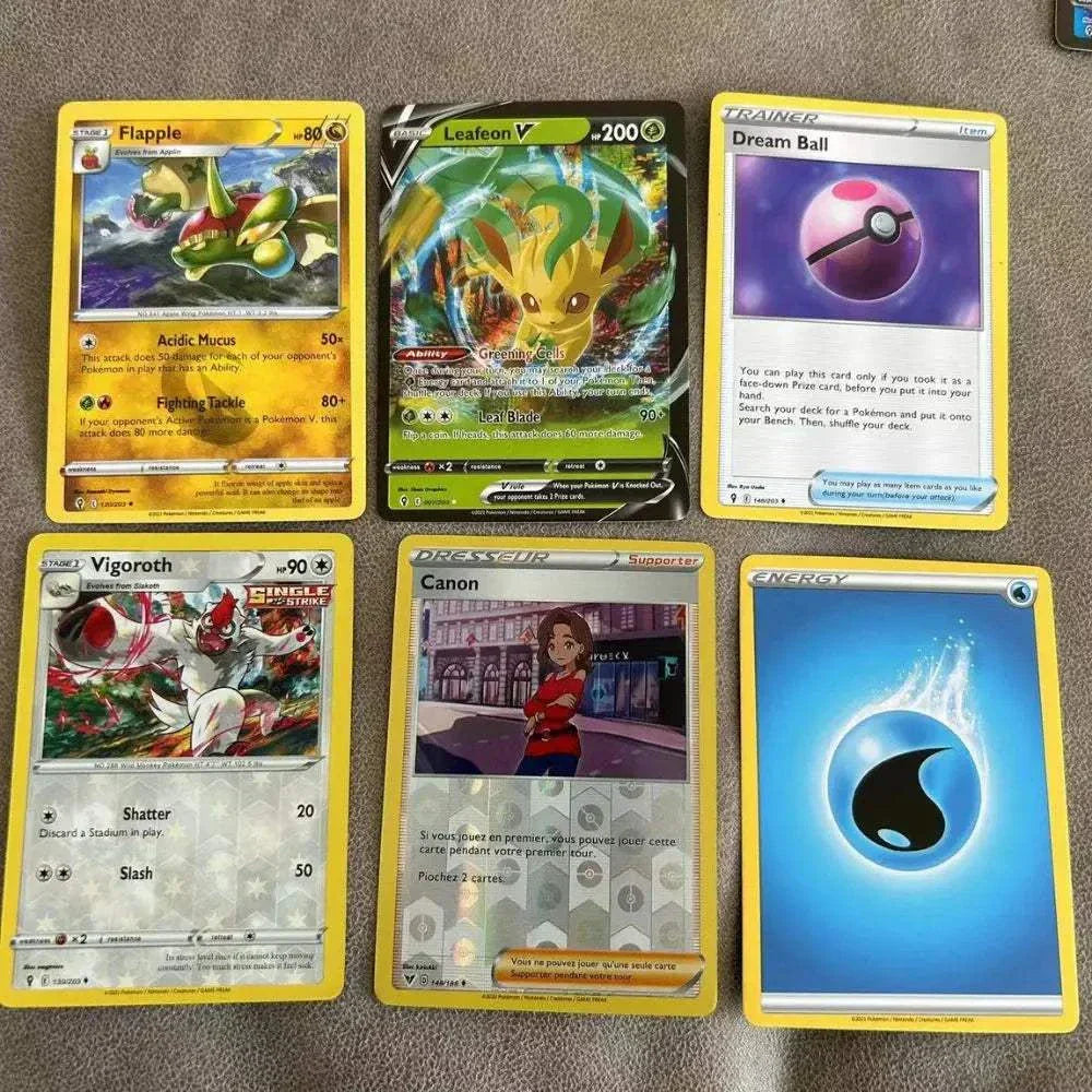 360Pcs Pokemon English collectible trading cards set on display featuring Flapple, Leafeon V, and others.